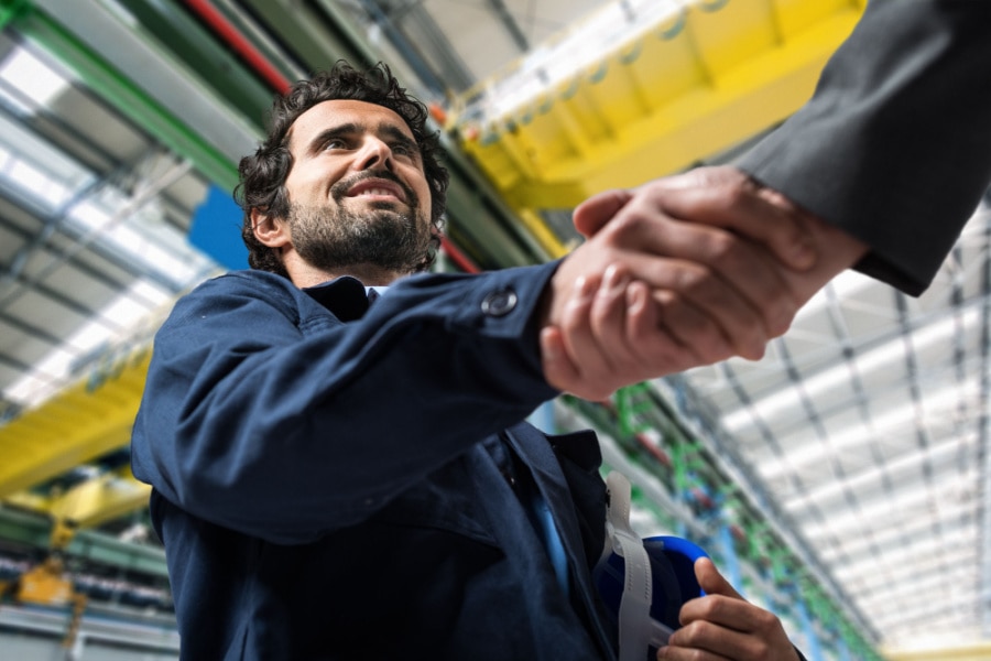 confident male business owners shaking hands.