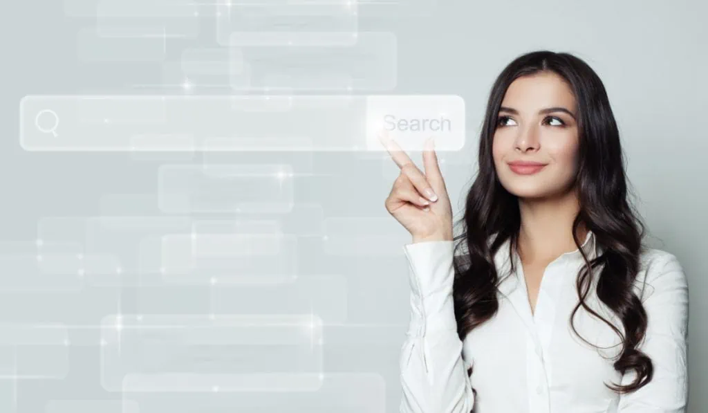 business woman pointing at a digital search bar.