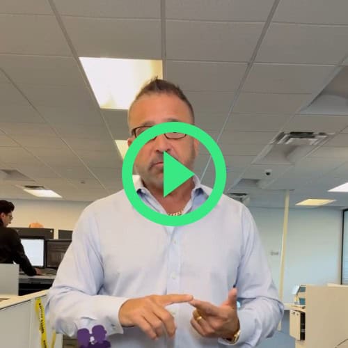 Hozio corporate office team working in an open-plan workspace, modern office environment, technology and collaboration, professional business setting, Hozio Inc.