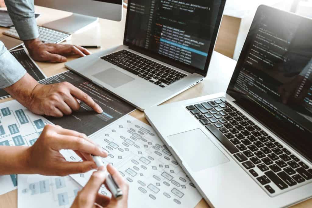 Laptop and coding work for software development and programming projects.
