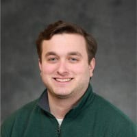 High-tech office workspace with professionals collaborating and using modern equipment.