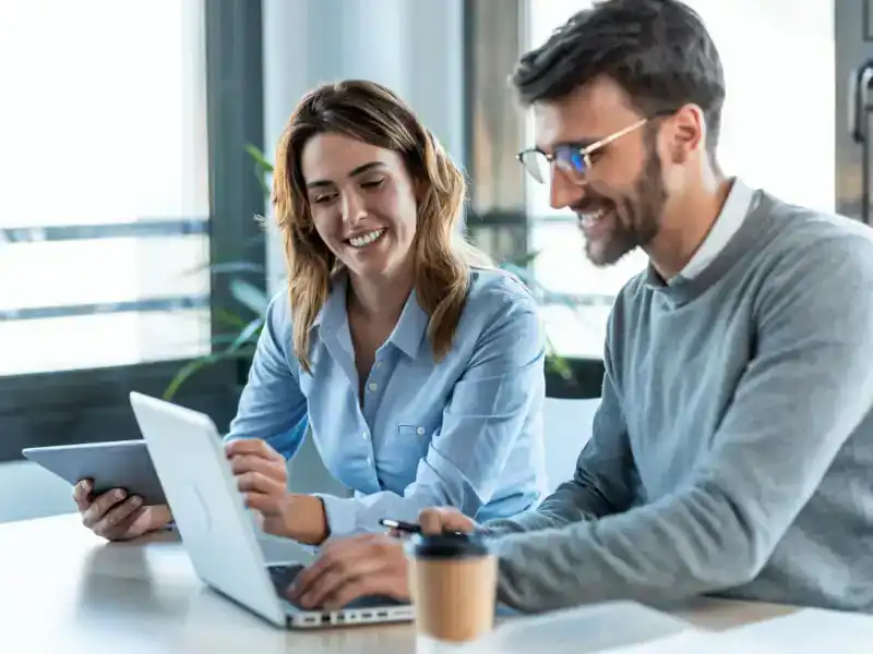 Modern professionals collaborating in an office using digital devices for business solutions.